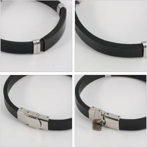 A custom leather bracelet in black with metallic clasp details, featuring a sleek and modern design.