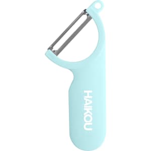 A light blue peeler with a stainless steel blade and a branded handle.