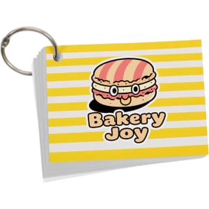A7 index cards with a yellow and white striped design, featuring a cartoon hamburger character and a ring for organisation.