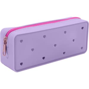A purple silicone pencil case with heart-shaped holes and a pink zipper. Features a branding logo on the side.