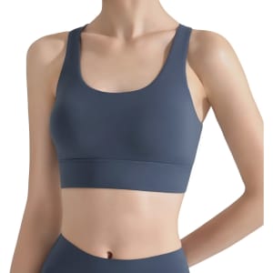 A women's cross back yoga crop bra tank in a dark blue hue, featuring a sleek and minimalistic design.