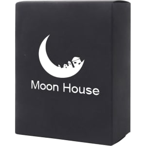 A small black gift box with a curved moon design and a label featuring the text "Moon House."