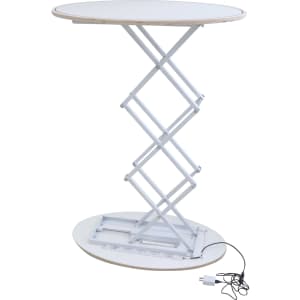 A backlit LED spring-up display table in white with a round top and a collapsible scissor mechanism.