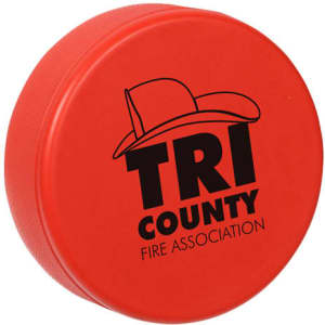 A red hockey puck-shaped stress reliever featuring a logo and a textured surface.