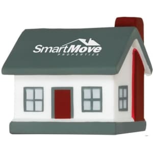 A house-shaped stress reliever in white and grey, featuring a red door and chimney, with a logo on the front.