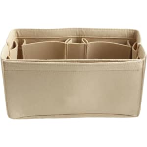 A beige felt bag organiser with multiple compartments for easy storage and organisation. It has a simple, clean design.