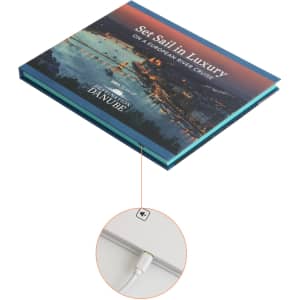 A promotional video brochure featuring a scenic cover image and a USB charging cable. It includes a logo.
