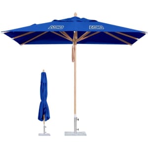 A square outdoor umbrella in blue with a timber pole and a base, featuring a logo on the canopy.