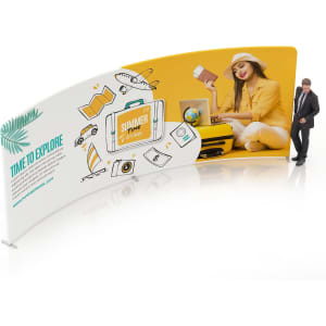 A C-shaped tension fabric display wall featuring vibrant yellow and white graphics, with a logo and imagery related to travel.