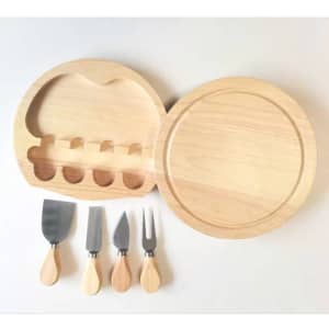 A cheese board set in light wood, featuring a round board and four stainless steel cheese knives with wooden handles.