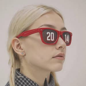 Red pinhole sticker sunglasses with a perforated design, featuring the numbers "20" and "14" on the lenses.