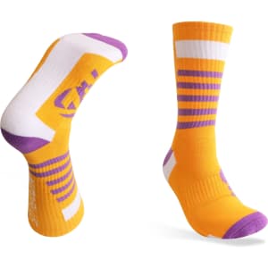Premium crew socks in vibrant orange with purple stripes and a towel bottom, featuring a logo on the side.
