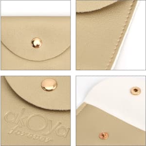 A gold PU leather jewelry pouch with a snap closure and embossed branding. Features a smooth texture and minimalist design.