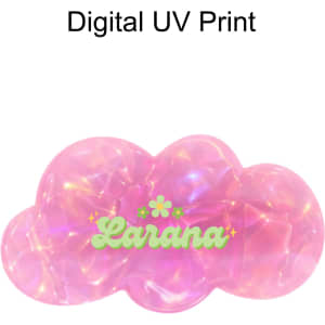 A pink iridescent alligator hair clip in a cloud shape with a logo. Features a digital UV print design.