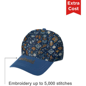 A navy cap featuring a floral pattern and a blue peak, with an area for custom embroidery. It has a logo present.