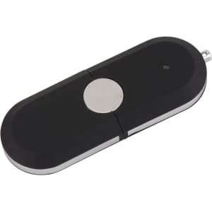 A black and silver Tauris flash drive with a circular button and a keychain loop.