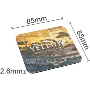 A square frosted metal coaster in shades of yellow and blue, measuring 85mm x 85mm and 2.6mm thick.