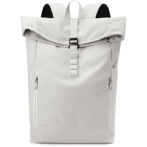 A grey canvas roll top vintage backpack with adjustable straps and zippered pockets. It features a logo on the front.