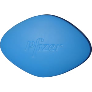 A blue tablet-shaped stress reliever with a logo on one side.