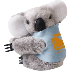 A grey koala plush toy with large ears and a blue scarf, featuring a logo, designed for clipping onto items.