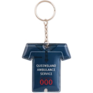 A blue PVC keyring shaped like a polo shirt, featuring a logo and silver keychain attachment.