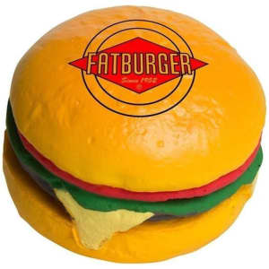 A yellow hamburger-shaped stress reliever with red, green, and yellow details, featuring a logo on top.