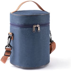 A cylindrical lunch bag in navy blue with a zip closure and adjustable shoulder strap. Features a carrying handle.