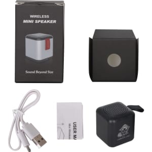 A black Bluetooth speaker with a compact design, accompanied by a USB charging cable and user manual.