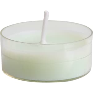 A tealight candle in a clear holder, featuring a pale green wax and a thin white wick.