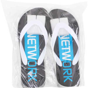 Black and white thongs with blue accents, packaged in a clear plastic bag, featuring a logo.