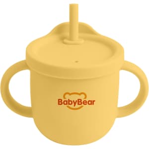 A drink bottle in yellow silicone with a straw and two handles, featuring a logo on the front.