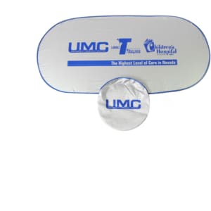 A silver car shade with a blue trim, featuring a logo and a circular storage bag.
