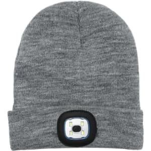 A grey beanie featuring a built-in headlamp, with a circular light panel on the front. It has a logo on the side.