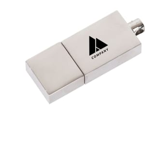 A silver flash drive with a logo displayed on its surface. The design is sleek and compact.