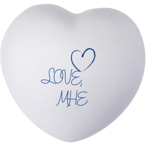 A white heart-shaped stress reliever with blue text reading "LOVE, ME". Features a smooth surface and rounded edges.