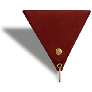 A triangular red coin holder made of leather with a keyring attachment and a brass button.