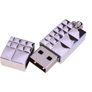 A silver USB flash drive with a textured design, featuring a removable cap. It has a small attachment loop.