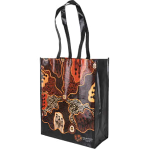 A laminated non-woven bag featuring a vibrant design in black, orange, and earthy tones, with sturdy handles and a large gusset.