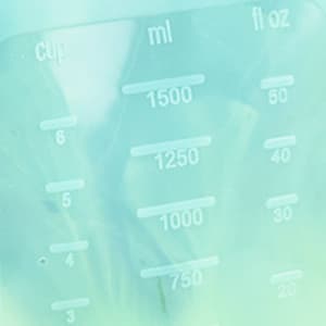 A translucent silicone pouch with measurement markings, designed for storage, in a pale blue hue.