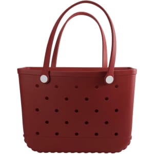A red EVA beach bag with perforated design and two sturdy handles. It features a smooth, flexible body and rounded edges.