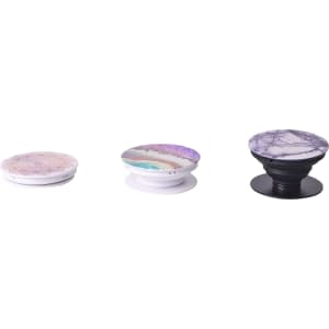 Three phone pop holders in various designs, featuring pastel colours and intricate patterns. Each holder has a different base colour.