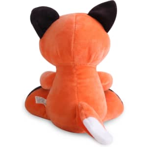 An orange fox plush toy with black ears and a white-tipped tail, sitting upright, featuring a logo on its side.