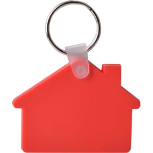 A red keyring shaped like a house, featuring a silver keyring attachment. It has a simple, solid design.