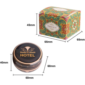 A peppermint tin candle in a colourful box featuring a logo, measuring 60mm in diameter and 40mm in height.