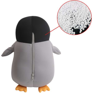 A penguin-shaped plush travel pillow in grey and black, featuring a zippered opening, with a close-up of the inner filling.