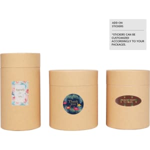 Three large brown paper cylinder boxes with various decorative stickers, showcasing different designs and sizes.