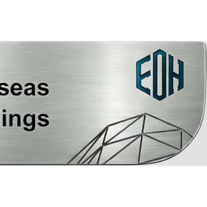 A custom metal name badge featuring a brushed silver finish and a logo in blue and black.