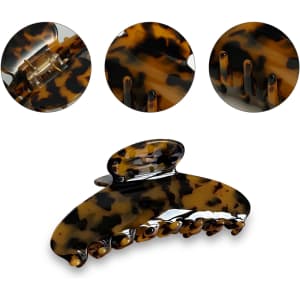 A tortoiseshell acetate hair clip with a glossy finish, featuring multiple gripping teeth and a compact design.