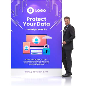 A man in a suit stands beside a purple and blue pop-up display wall with a logo and technology-themed graphics.