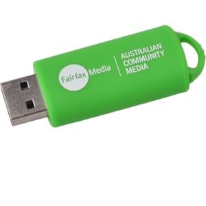 A green flash drive with a loop attachment and a logo, featuring a USB connector.